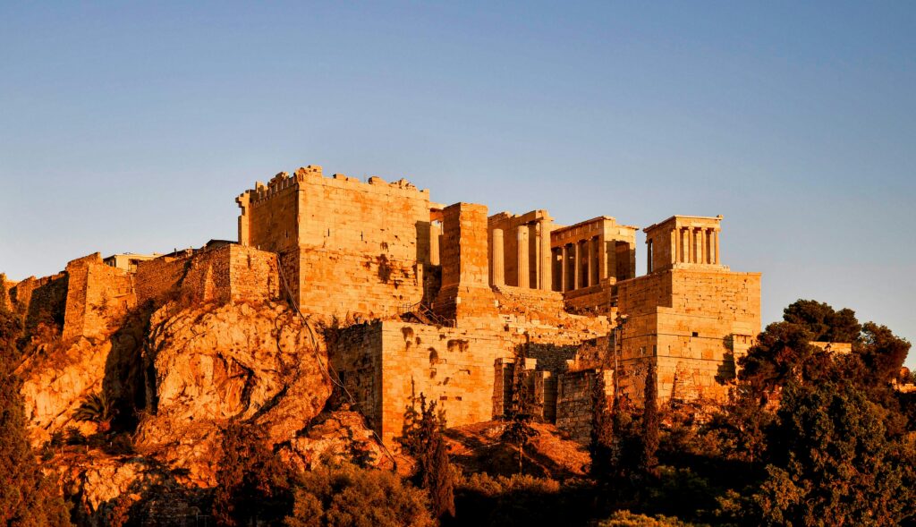 Stunning view of the Acropolis in Athens bathed in warm sunset light.