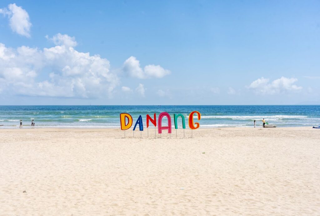 Bright and sunny day at Da Nang beach in Vietnam with clear skies and a calm sea.