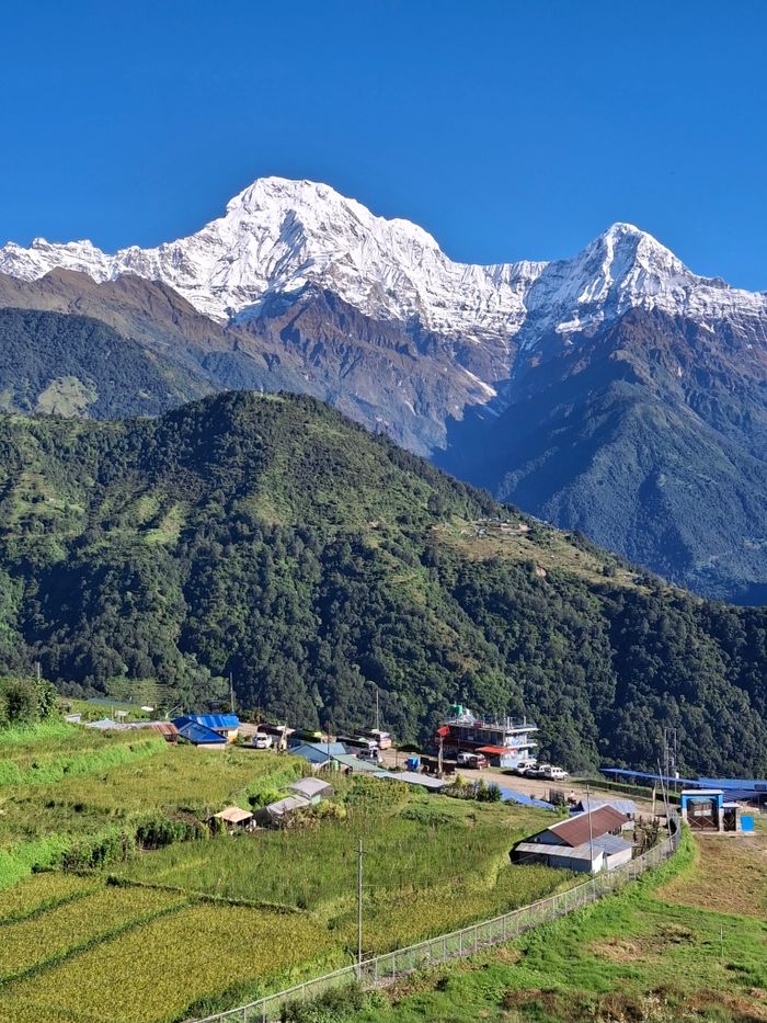Breathtaking view of Annapurna mountains and lush valleys in the Himalayas.