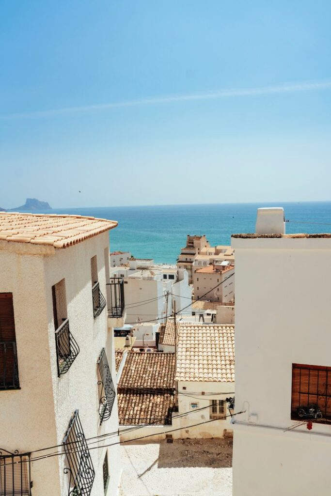 Charming Mediterranean village overlooking the sea on a sunny day.